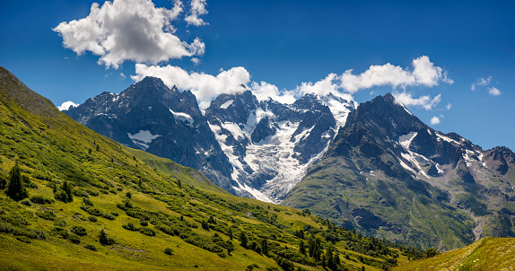 Aerial view of glaciated mountains and blue sky