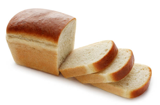istock Fresh delicious sliced wheat bread on white 1366796678