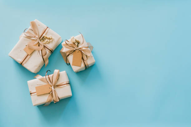 istock Craft paper gift boxs set on blue background with copy space for text. 1366797525