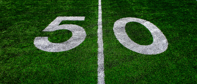 Football field green grass white yard markers to touchdown competition game