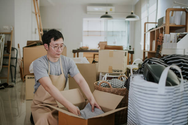istock Mature man prepping Donation box 1366798960