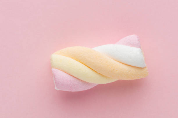 istock Colorful marshmallows on pastel background. 1366799379
