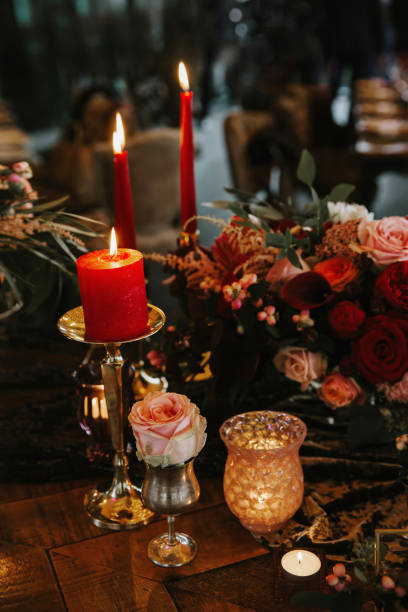 istock Romantic red table, decorated table with flowers and red candles. Luxury Christmas evening or wedding party decoration. 1366799457