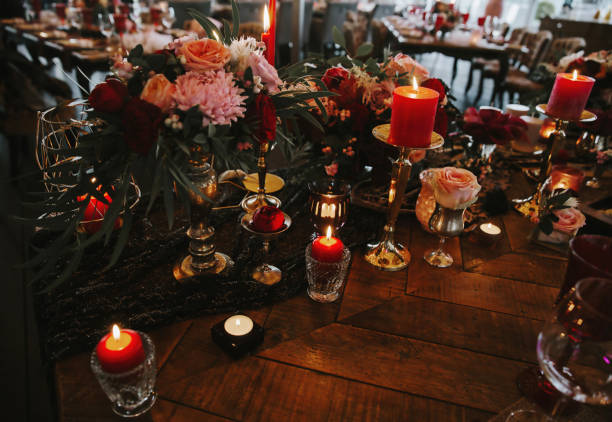 istock Romantic red table, decorated table with flowers and red candles. Luxury Christmas evening or wedding party decoration. 1366799461