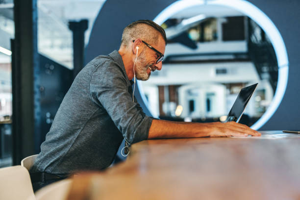 istock Experienced businessman smiling during a virtual meeting 1366799896