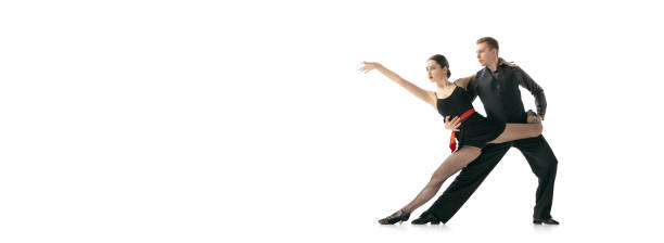 istock Horizontal flyer with flexible young dancers dancing Argentine tango isolated on white studio background. Artists in black stage costumes 1366800067