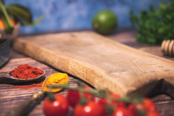 istock Cutting board on wooden table. Cooking concept 1366800797