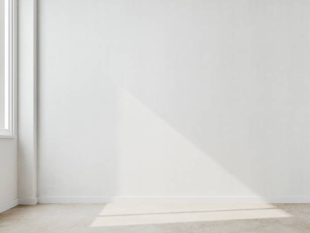 istock Empty white room with sunlight from the window on the wall.3d rendering 1366801322
