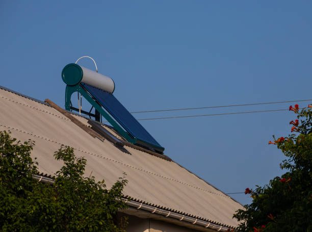 istock Solar water heater on roof top, beautiful blue sky background 1366801343