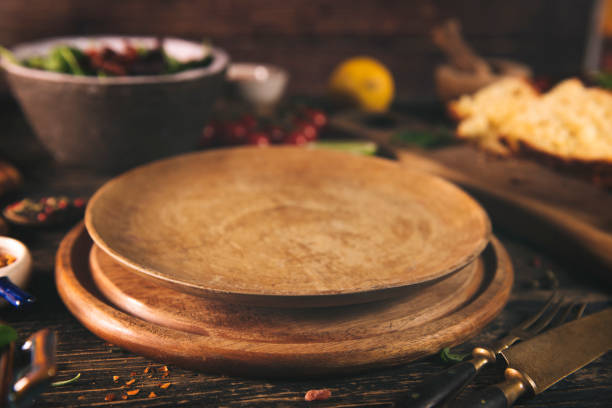 istock Empty board for pizza on wooden desk 1366801586