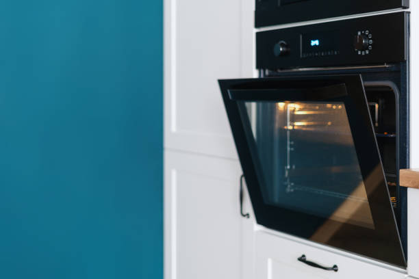 istock Stylish oven with open door in modern kitchen 1366803698