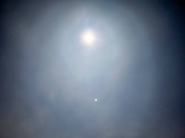istock View into the cold blue sky with stars and moon. 1366805053