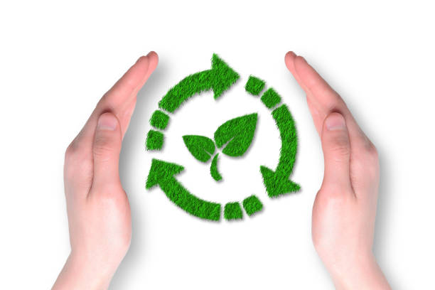 Recycle symbol made of grass with hand protective on white background. Ecology, sustainability and environmental concept