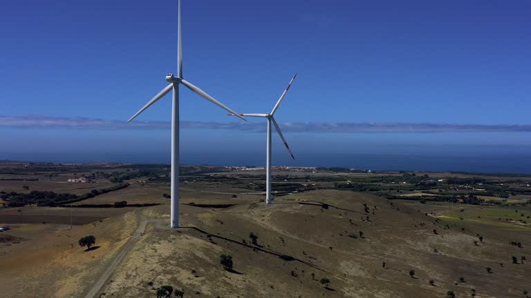Wind Turbine in a rural scene, Portugal, Alentejo.  It's a clean fuel source. Wind energy doesn't pollute the air like power plants that rely on combustion of fossil fuels, such as coal or natural gas.
