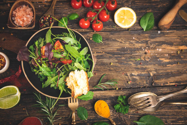 Fresh vegetables salad on wooden table