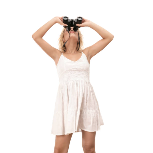 Young blond woman with binocular