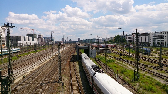 train and car traffic in motion blur on the ramp to the cologne severins bridge