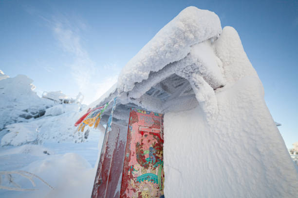 istock Ribbons sway in the icy wind. Gate of a Buddhist monastery 1366807955