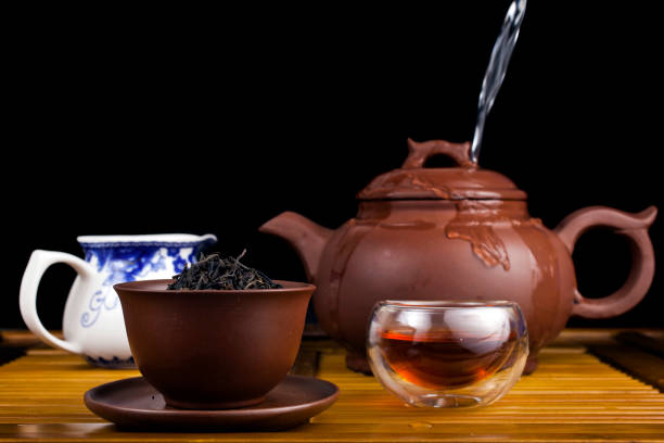 istock Clay teapot with smoked red tea Lapsang souchong 1366808773