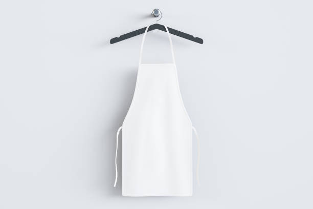 istock Empty white kitchen apron on hangers. Light background. Chef and cooking concept. Mock up place. 3D Rendering. 1366809282