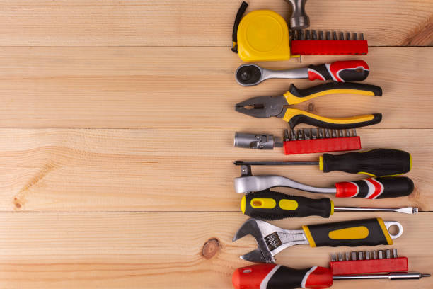 istock A set of hand tools on a wooden board. View from above. Copy space. 1366809656