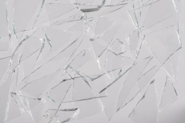 istock Pieces of broken glass on a white background. 1366810428