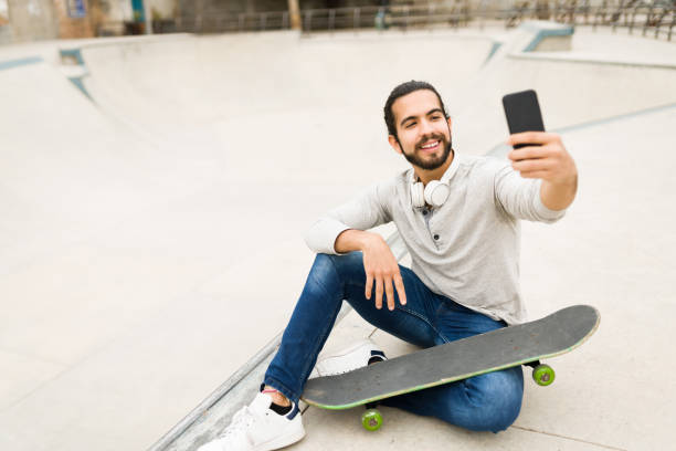 istock Active man usuing a skateboard at the park 1366812635
