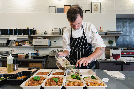 Chef cooking healthy food for delivery