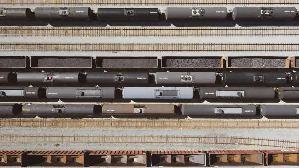 Aerial View of a Train Depo next to a large highway