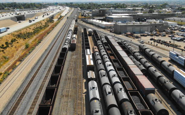 Aerial View of a Train Depo Aerial View of a Train Depo next to a large highway shunting yard stock pictures, royalty-free photos & images