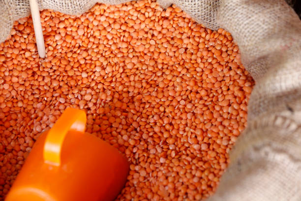 istock Bag of red lentils in bulk 1366818498