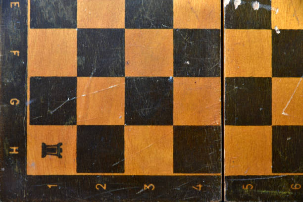 istock An old chessboard with scuffs without pieces 1366819654
