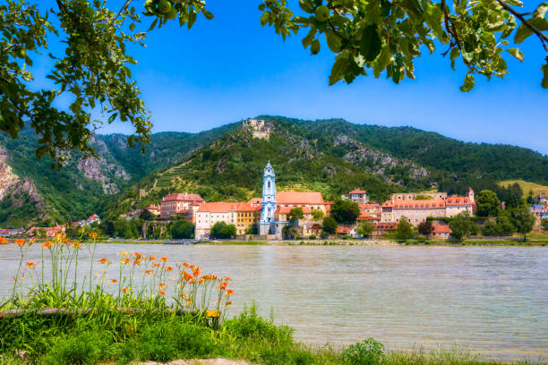 The Beautiful Village of Dürnstein on the River Danube in Austria, Dominated by the Abbey Church The beautiful village of Dürnstein on the River Danube in Austria, dominated by the Abbey Church durnstein stock pictures, royalty-free photos & images