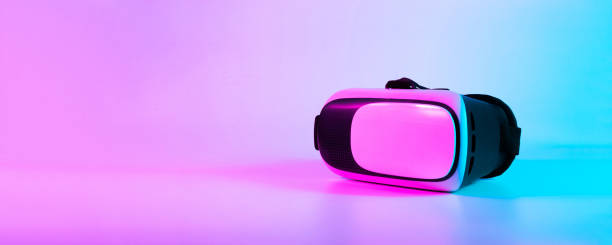 istock VR headset virtual reality. 3d digital glasses on futuristic neon tech background. Innovation device, cyberspace technology. 1366822214