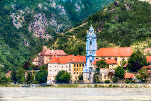 The Beautiful Village of Dürnstein on the River Danube in Austria, Dominated by the Abbey Church The beautiful village of Dürnstein on the River Danube in Austria, dominated by the Abbey Church durnstein stock pictures, royalty-free photos & images