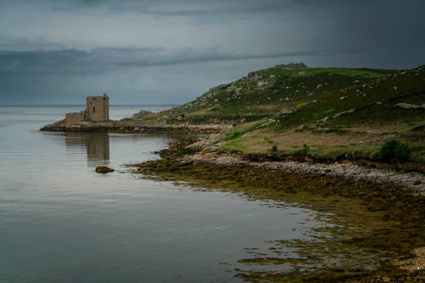 Cromwell's Castle in coastline on Tresco island in the Isles of Scilly. England stock photo
