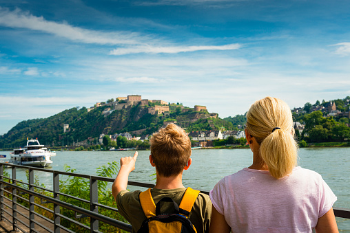 mother and son standing at Mosel River in Koblenz in Germany