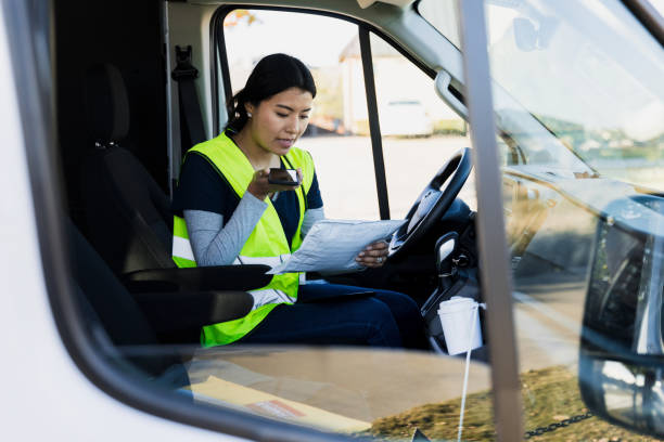 istock Mail person confirms delivery schedule on smart phone 1366824790