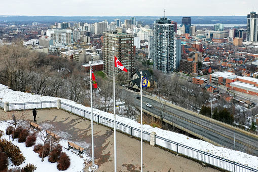 An aerial view of Hamilton, Ontario, Canada downtown with flags in foreground
