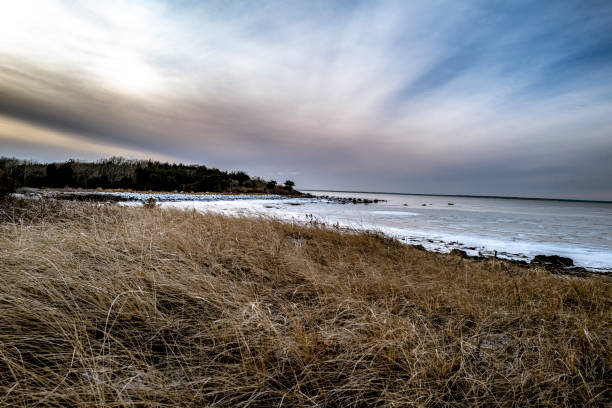 A view of the beach and breaker at North Falmouth, MA.  The water in the photo is Buzzards Bay which leads out to the Atlantic Ocean.