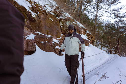 People Hiking on the Mountain with Snow