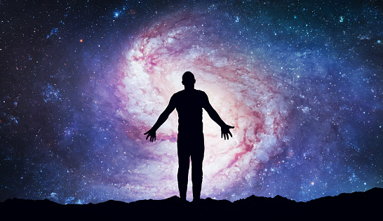 Silhouette of man stand on top of mountain and see in the night sky. Galaxy and space. Meditation and astrology. Esoterica and psychology. Elements of this image furnished by NASA (url:https://www.nasa.gov/sites/default/files/styles/full_width_feature/public/thumbnails/image/potw2049a.jpg)