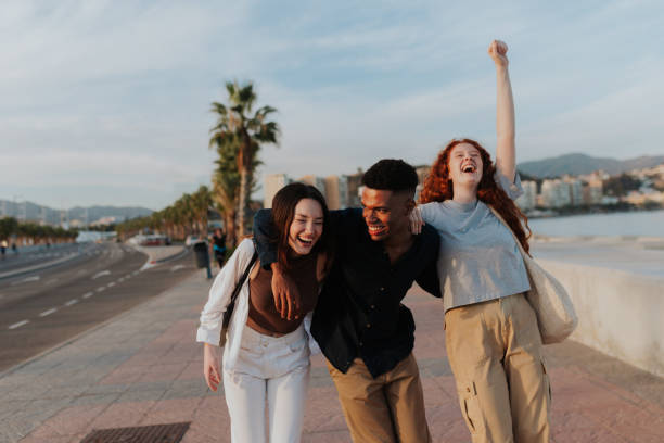 istock Joyful friends having a good time in the waterfront 1366830217