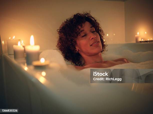 https://media.istockphoto.com/id/1366830326/photo/woman-enjoying-a-candlelight-bath.jpg?s=612x612&w=is&k=20&c=kAGWbjdEHpCykNKQub87nHc26lDHNd1SL0VTfzqmJf8=