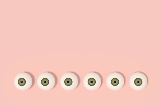 3d rendering of glossy eyeball, eye iris on pink background.