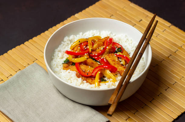 istock Rice with fried chicken, pepper and sesame. Asian food. 1366831929