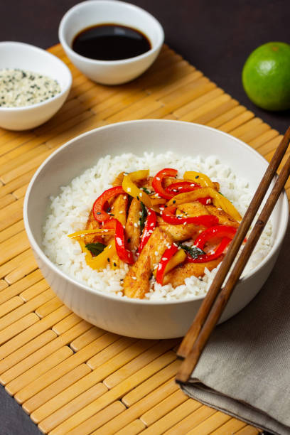 istock Rice with fried chicken, pepper and sesame. Asian food. 1366831934