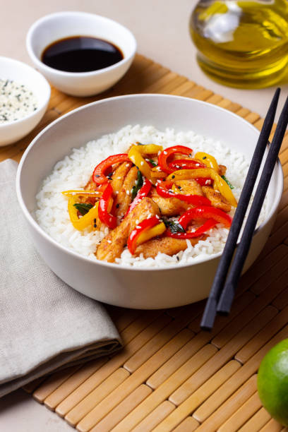 istock Rice with fried chicken, pepper and sesame. Asian food. 1366832107