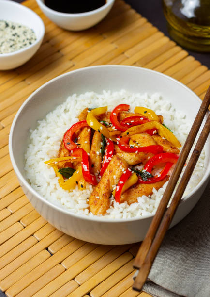 istock Rice with fried chicken, pepper and sesame. Asian food. 1366832733