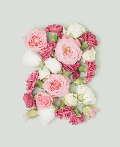 istock Spring flowers arranged on a pastel green background. 1366833324